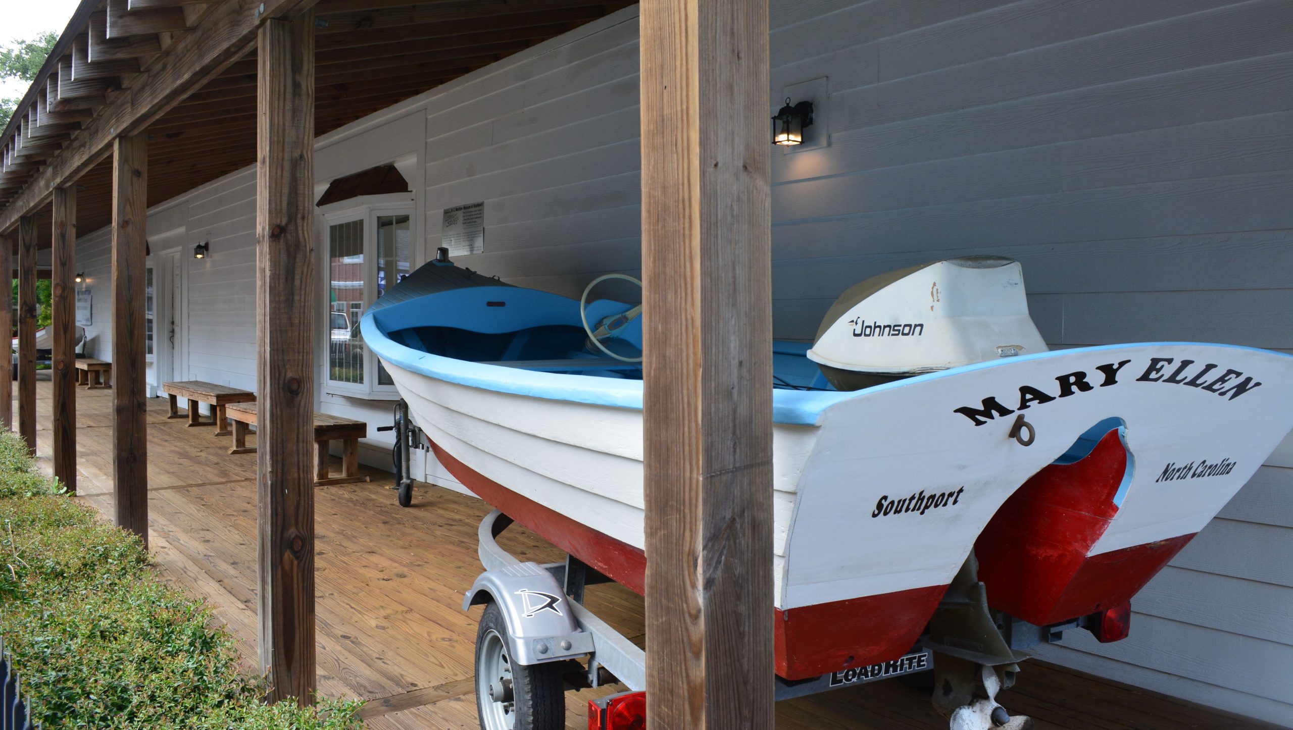 wooden boat named Mary Ellen on the museum porch