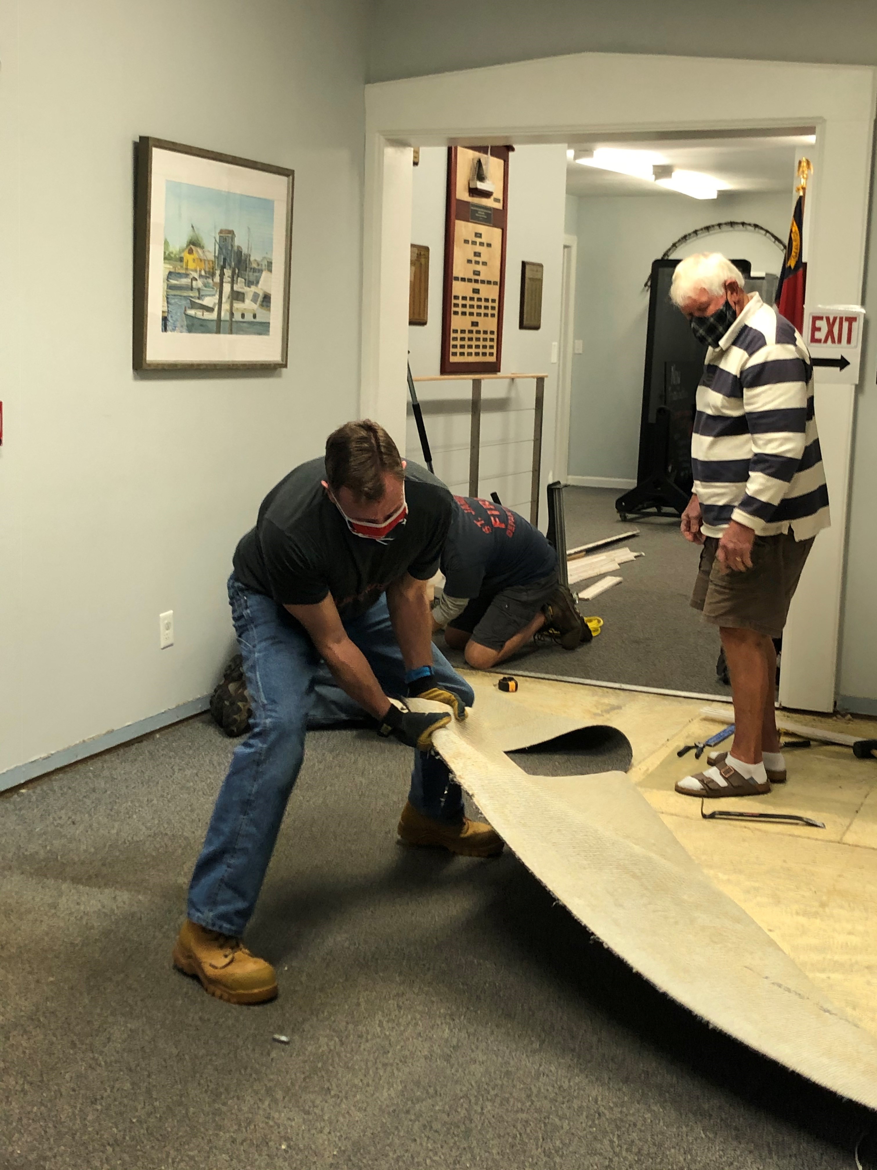 Museum volunteers help with facility repairs and upkeep