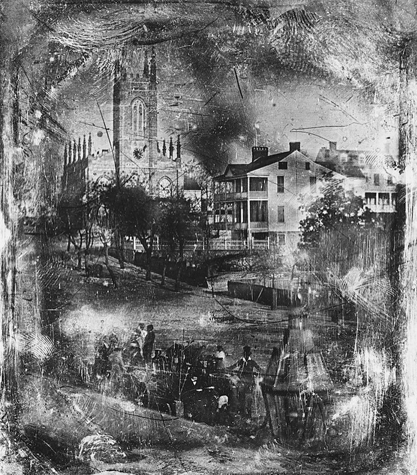 historic black and white image of a port town